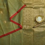 Olive Green Kanjivaram Rich Cotton Saree with a Bright Red Selvage